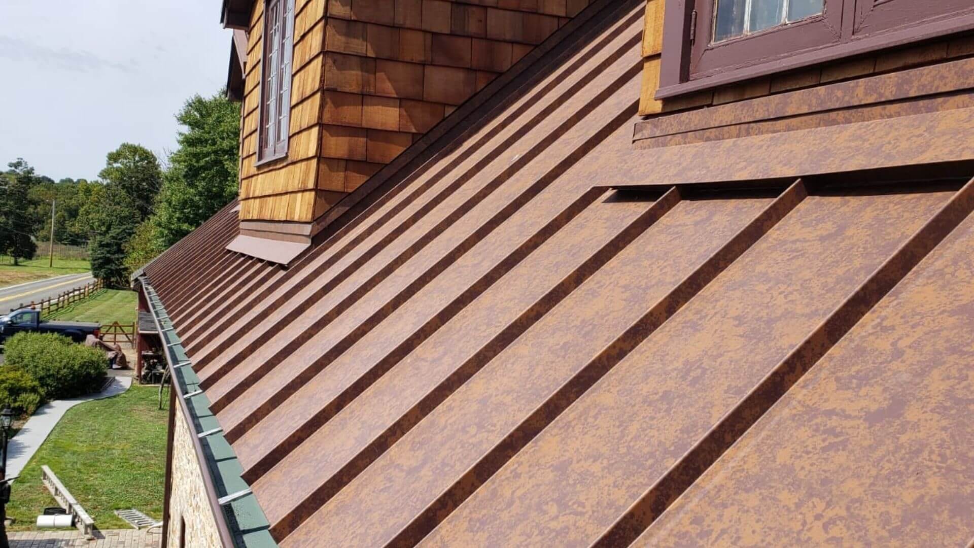 Before: aging asphalt roof and worn siding